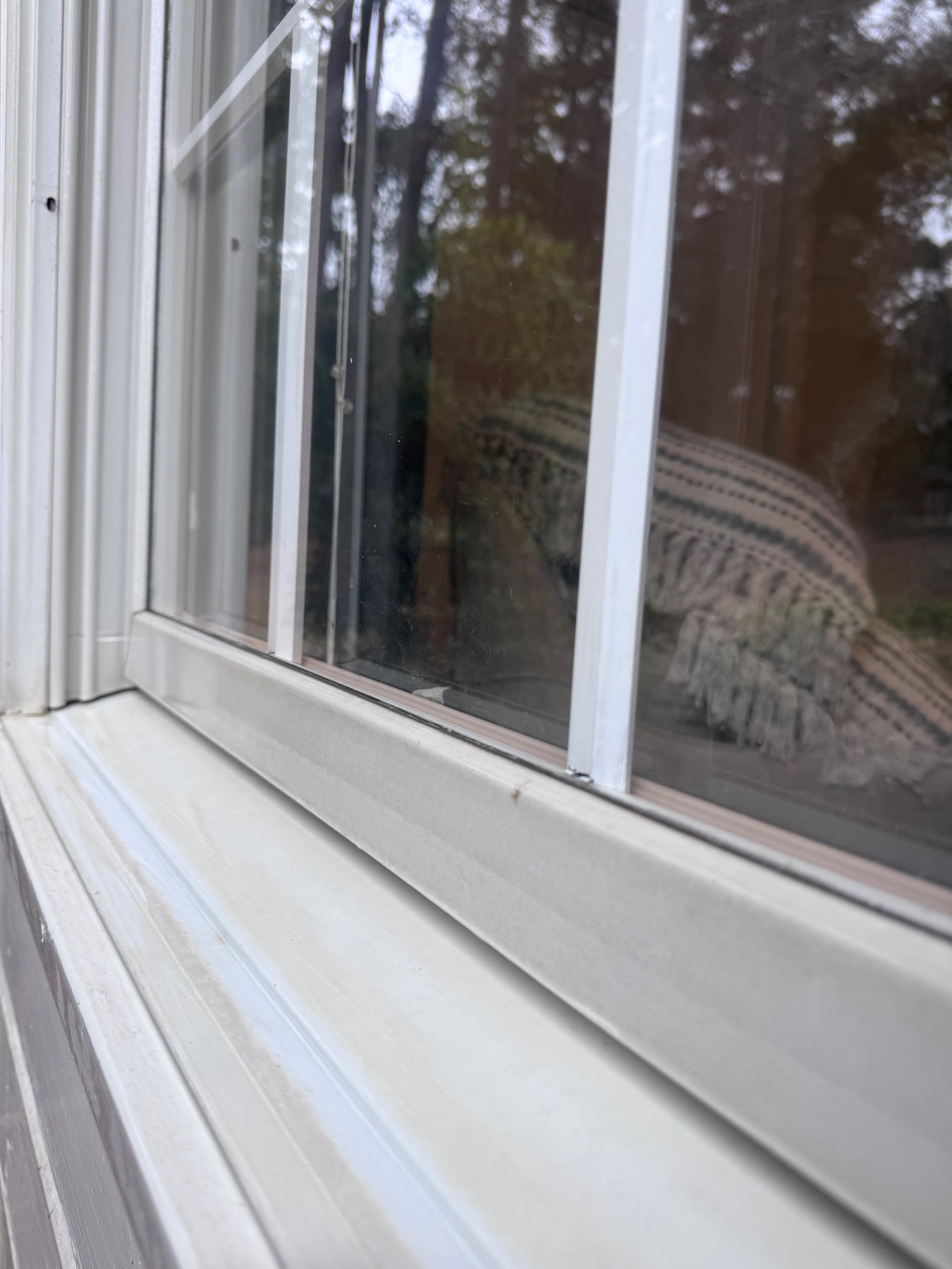 A cleaned window track and sill after detailing.